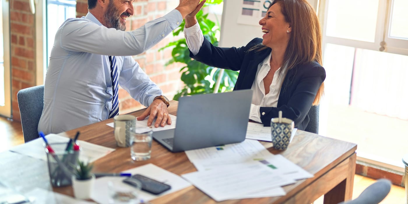 A business team evaluating managed IT provider proposals in a meeting room